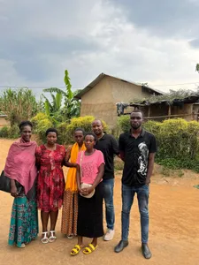 Four Kubana community members standing together outdoors
