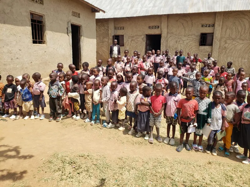 A large group of students gathered outside their school
